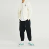 Pantalones casuales Converse para hombre de color liso, tejido, con cordones y diseño «Bundle Feet», en negro
