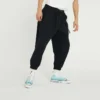 Pantalones casuales Converse para hombre de color liso, tejido, con cordones y diseño «Bundle Feet», en negro