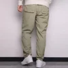 Pantalones casuales de hombre Converse de color liso, tejido y corte recto, gris claro y verde